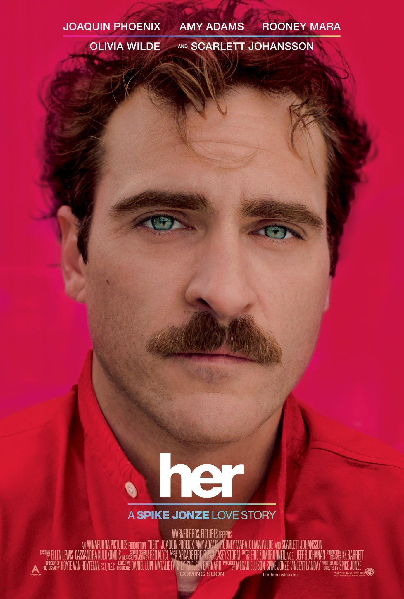A scene from the movie 'Her' showing the protagonist interacting with his AI operating system.