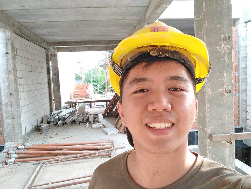 Employee taking selfie at work to prove he is at job site